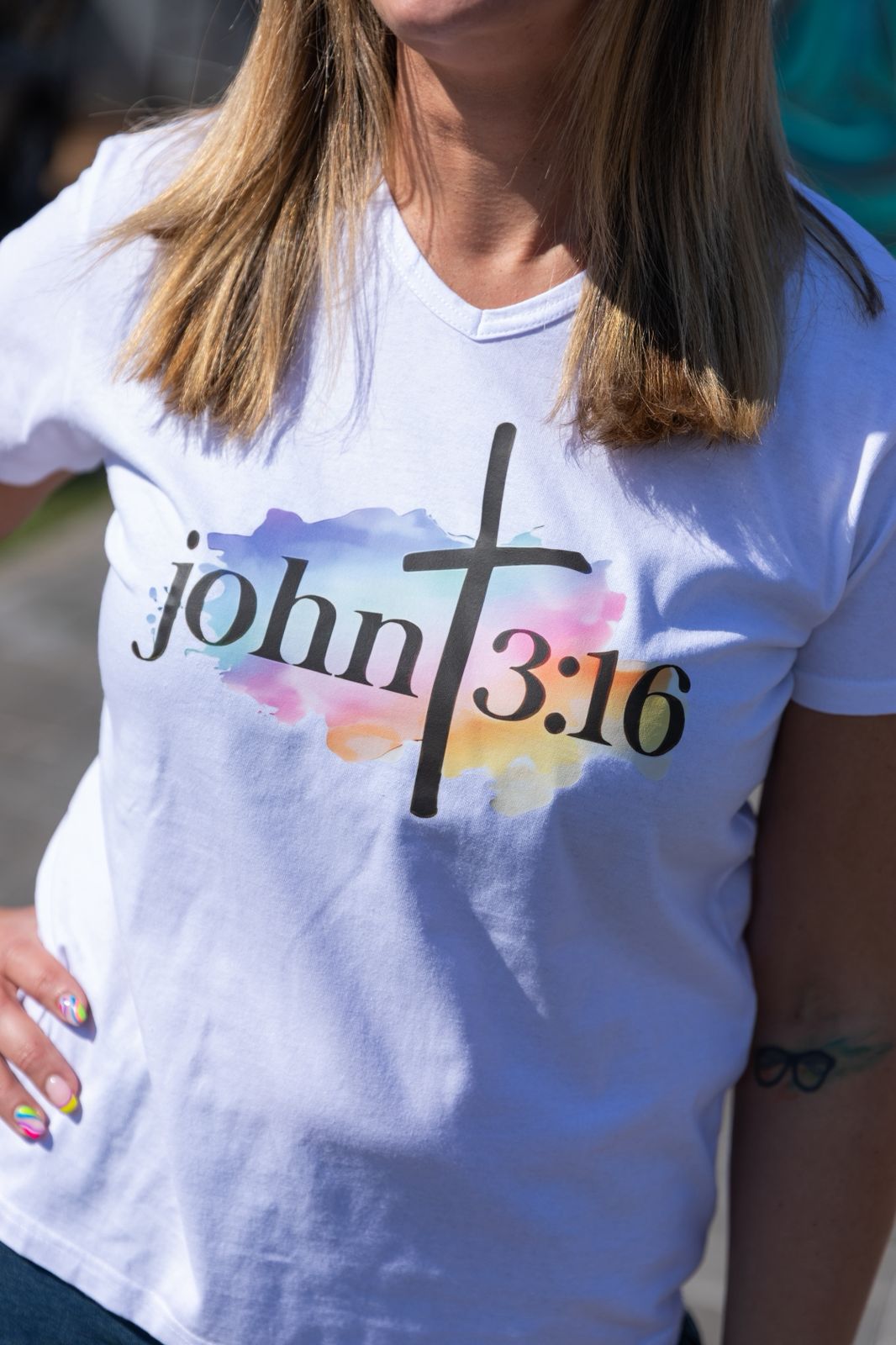 Faith in Fashion – Soft white ladies’ V-neck tees with a beautiful pastel watercolour splash background and bold faith declarations