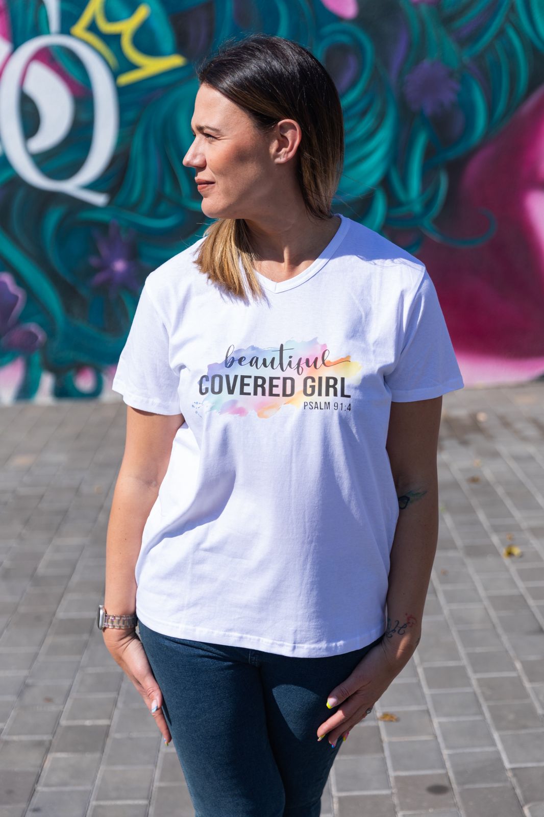 Faith in Fashion – Soft white ladies’ V-neck tees with a beautiful pastel watercolour splash background and bold faith declarations