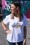 Faith in Fashion – Soft white ladies’ V-neck tees with a beautiful pastel watercolour splash background and bold faith declarations