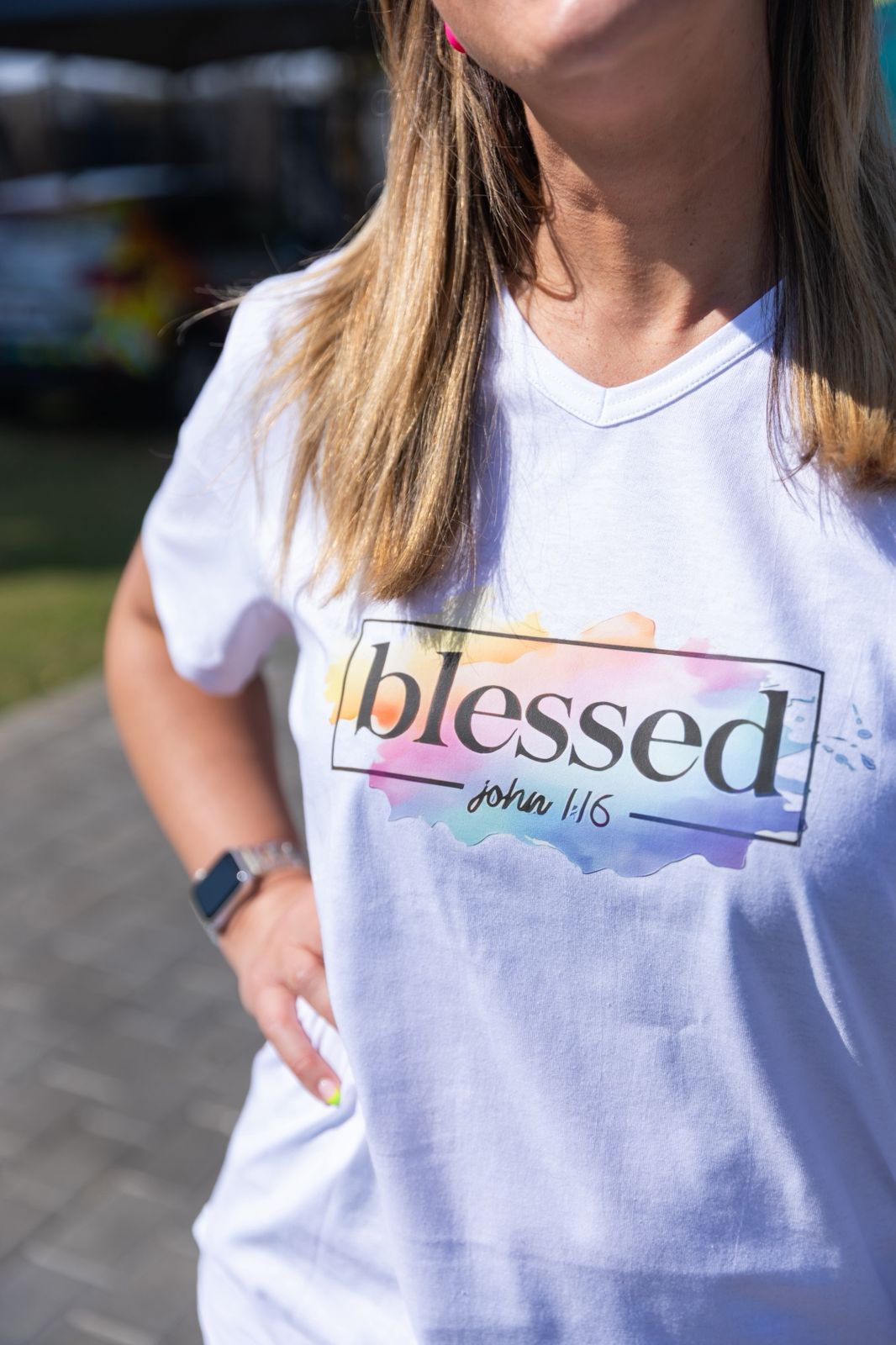 Faith in Fashion – Soft white ladies’ V-neck tees with a beautiful pastel watercolour splash background and bold faith declarations