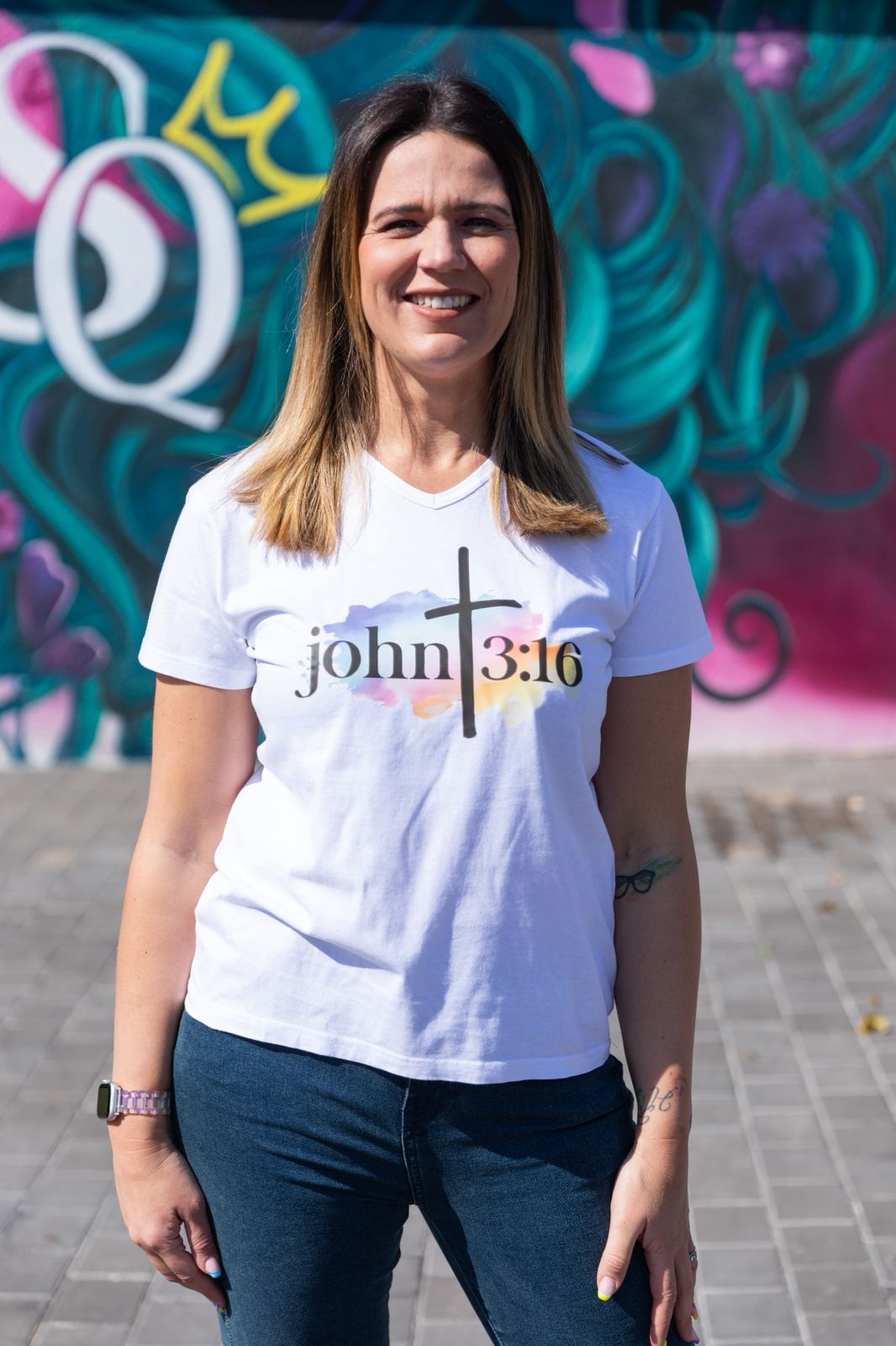Faith in Fashion – Soft white ladies’ V-neck tees with a beautiful pastel watercolour splash background and bold faith declarations