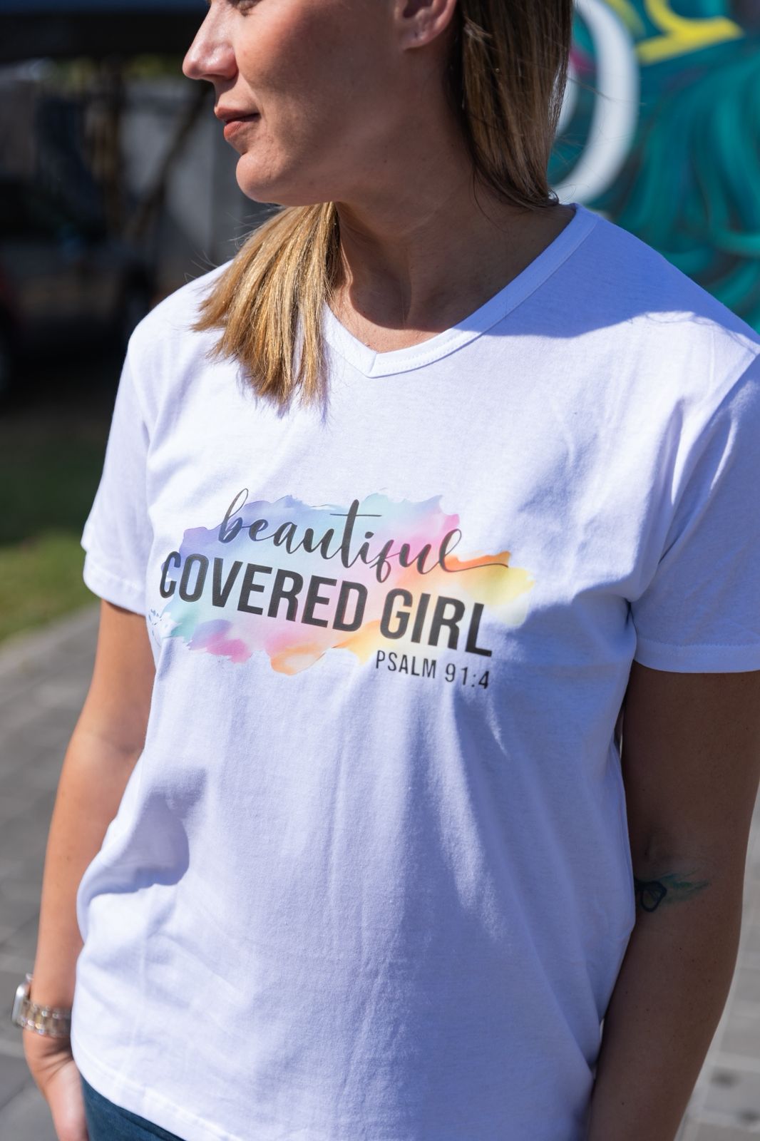 Faith in Fashion – Soft white ladies’ V-neck tees with a beautiful pastel watercolour splash background and bold faith declarations